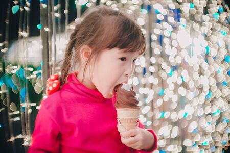 Little girl with led lights background in christmas and new year conceptの写真素材