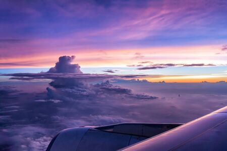 Airplane wing from the inside at twilightの写真素材