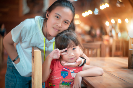 Sisters at restaurantの写真素材