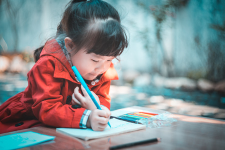 Girl doing homework at homeの写真素材