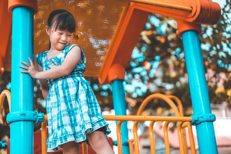 Happy child playing in playgroundの写真素材