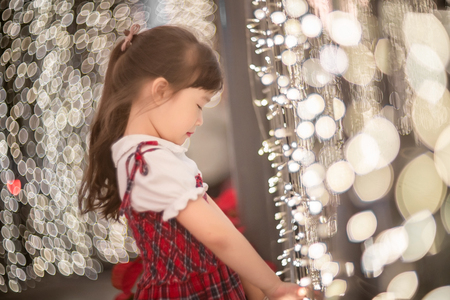 Happy little girl enjoying in new year festivalの写真素材
