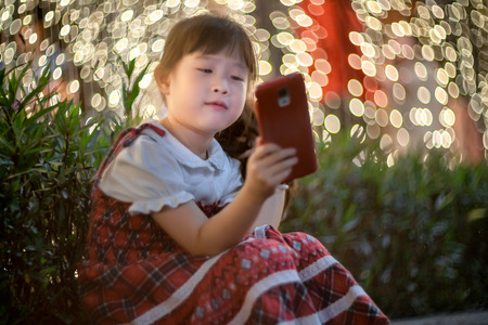 Happy little girl enjoying in new year festivalの写真素材
