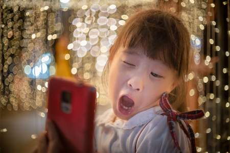 Happy little girl enjoying in new year festivalの写真素材