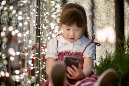 Happy little girl enjoying in new year festivalの写真素材