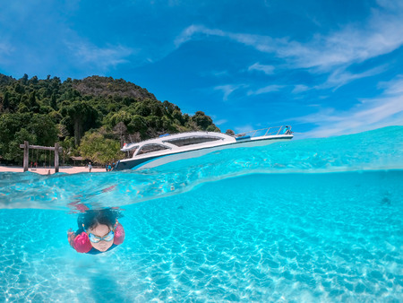 little girl snorkeling  at Nyaung Oo Phee Island Myanmarの写真素材