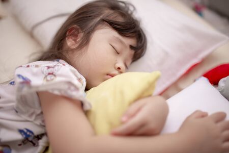 asian little girl sleepingの写真素材