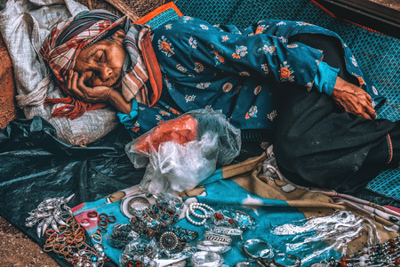 Chiang mai Thailand  - NOVEMBER 21,2012. The hill tribe old woman is sleeping at her shop, Chiang mai Thailandのeditorial素材
