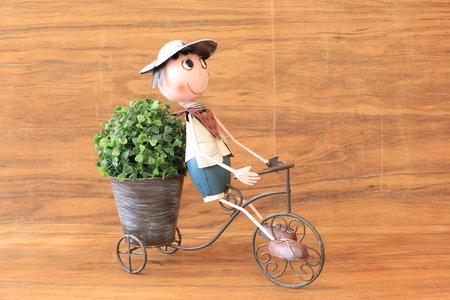 a boy is riding  the bicycleの写真素材