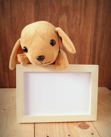 cute puppy and flame photo with wooden backgroundの写真素材