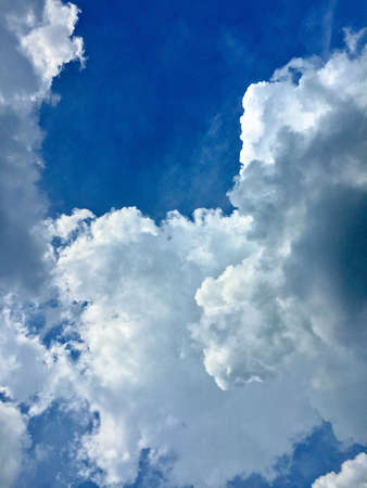 White clouds and deep blue sky at sunny day