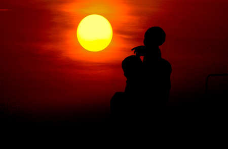 silhouette of the child sits on the shoulders of his father,Happy father's day at sunset.