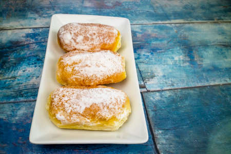 Butter Bread on white plate on vintage table,の写真素材