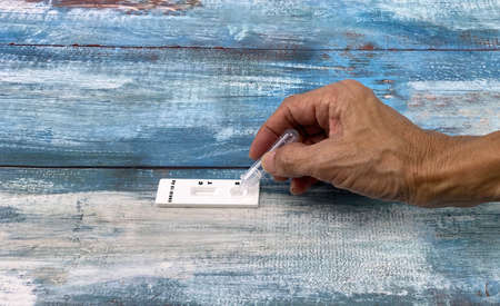 Close-up of adult people dropping fluid