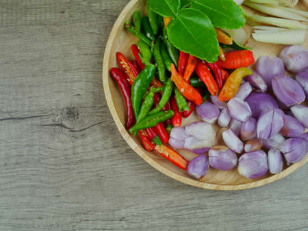 Ingredients for cooking spicy soup or TOM YUM on wooden backgroundの写真素材