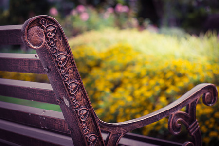 Rest on the bench at the beautiful gardenの写真素材