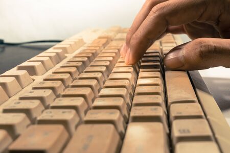 Hand typing old keyboard