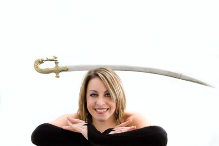 Face of a beautiful blonde balancing sword, isolatedの写真素材