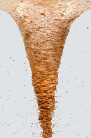 Side view of a tornado vortex swirl with wood chip debris, isolatedの写真素材