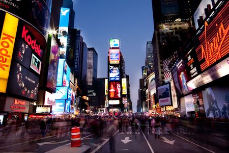 New York - 26 Nov. 2009: Night scene of Times Square in Manhattan (New York City) with all the lit up billboards and advertisements, and many tourists people walking by.のeditorial素材