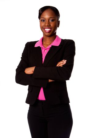 Beautiful happy smiling African corporate business student woman in suit standing with arms crossed, isolated.の写真素材