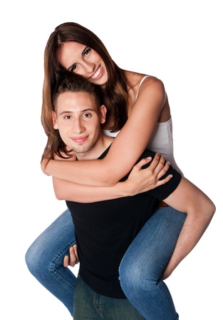 Beautiful happy smiling couple boyfriend girlfriend relationship with love piggyback hugging, isolated.の写真素材