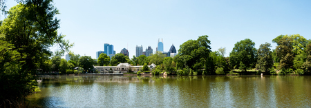 Lake Clara Meer in Piedmont Park with Atlanta Skyline and Aquatic Center.の写真素材