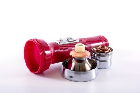 Open plastic flashlight isolated on a white background.の写真素材