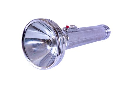 Old metal flashlight isolated on white background,Antique flashlightの写真素材
