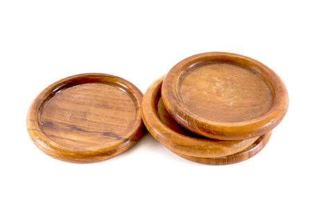 Four hand craft wooden saucer, wooden bottom plate isolated on whiteの写真素材