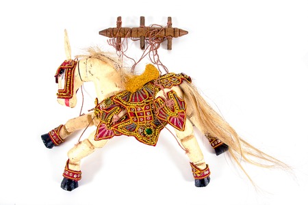Traditional horse marionette or horse puppet isolated on white backgroundの写真素材