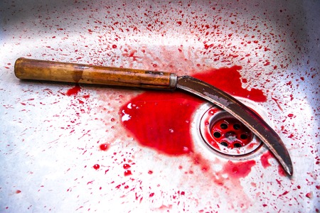 Sickle with blood at sink background,Kill concept,Murder conceptの写真素材