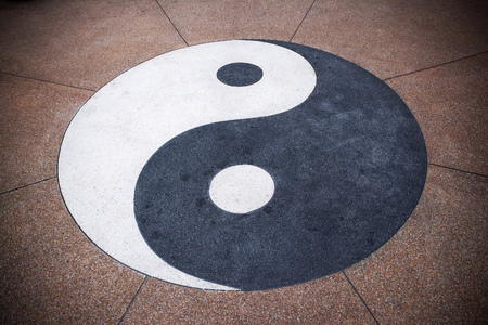Yin yang symbol on concrete background.Yin yang texture backgroundの写真素材
