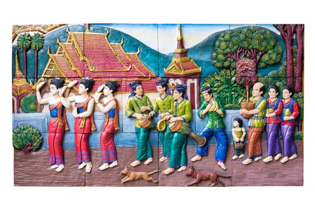 CHIANGMAI ,THAILAND - SEPTEMBER 9, 2016 : Stone carving of traditional Thai rural culture life in the past on temple wall at Wat Buakrokluang Chiangmai, Thailandの写真素材