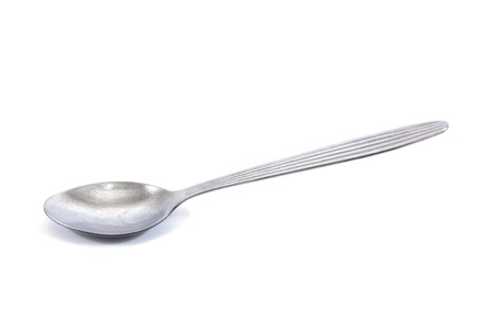 Teaspoon isolated on white.Stainless tea spoon isolatedの写真素材