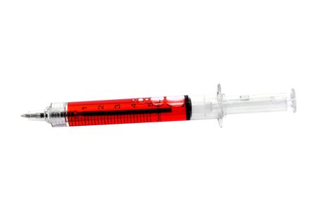 Ballpoint like needle with red liquid on a white background.Ballpoint injection needle pen isolatedの写真素材