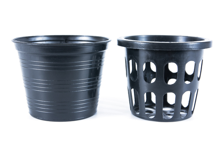 Two kind of black plastic flower pots on white background.Plastic flowerpot isolatedの写真素材