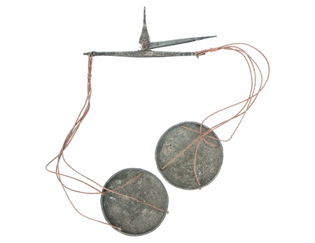 Old ancient weight scale isolated on white backgroundの写真素材