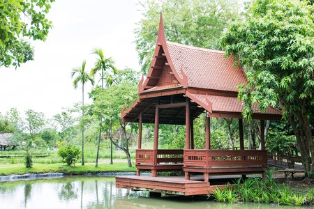 Wooden Thailand pavillion beside the pool in the parkの写真素材