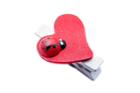 Hair pin in heart shape with ladybug style isolated on white backgroundの写真素材