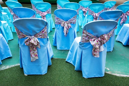 Chair decoration with tied clothes near show stage backgroundの写真素材