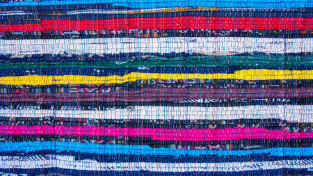 Colorful horizontal lines weave fabric sewing rough texture surface background. Multicolor woven...