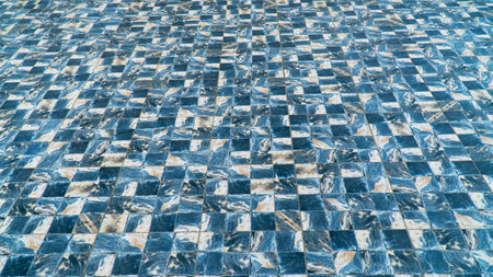 Marble tile floor with sea wave water design pattern. Marble tile floor with blue checkered pattern.の写真素材