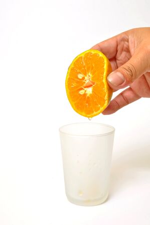 Hand pour orange juice の写真素材