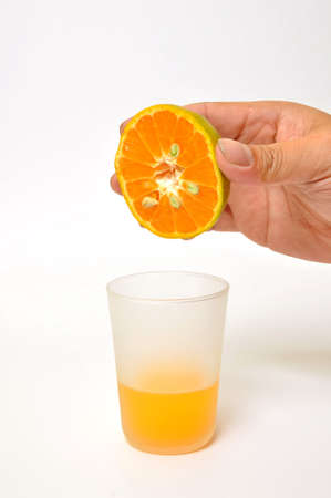 Hand pour orange juice の写真素材