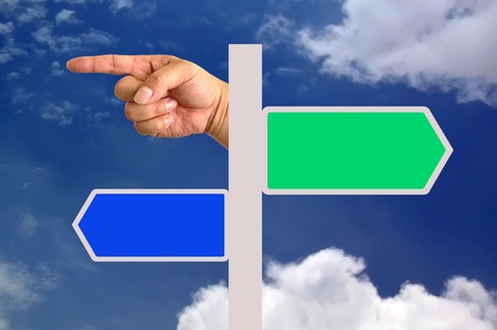 Direction traffic sign with handの写真素材