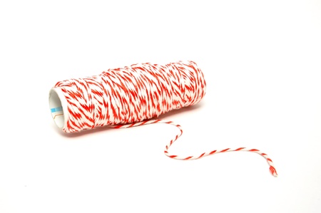 Roll of hemp string isolated on whiteの写真素材
