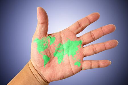 Human hands holding map worldの写真素材