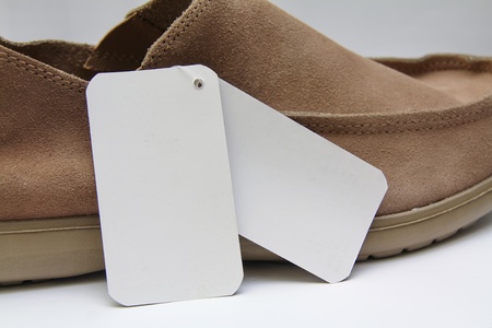 Price tag color white with brown shoesの写真素材