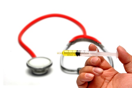 Syringe and handの写真素材